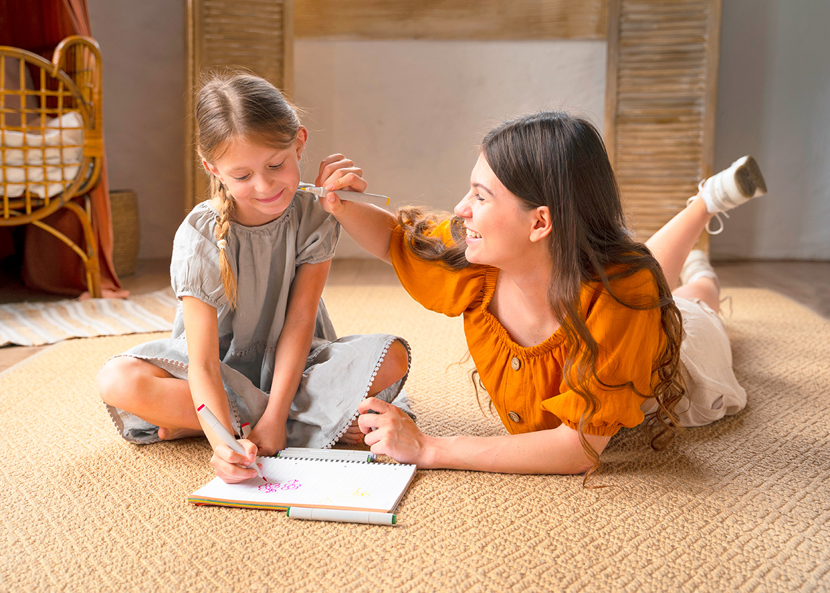 Parent and child smiling over a math workbook at home