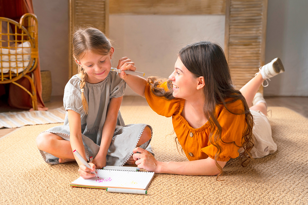 Parent and child smiling over a math workbook at home